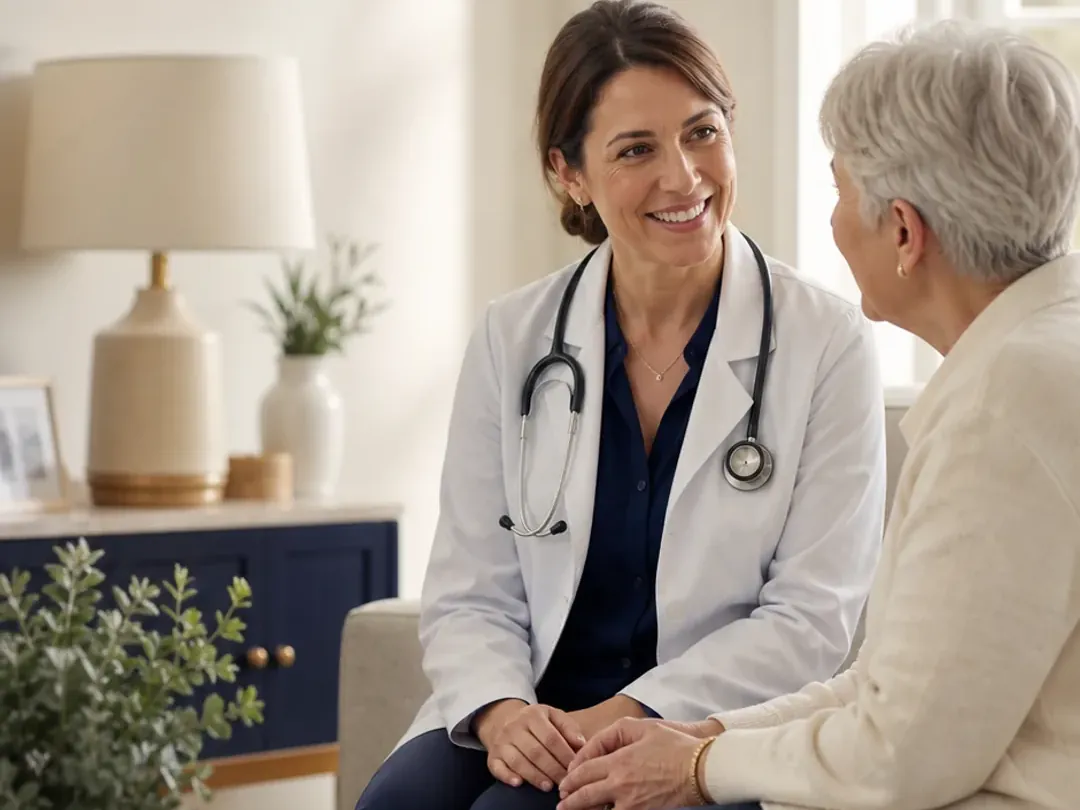 Clinician speaking with an older adult during an in-home visit