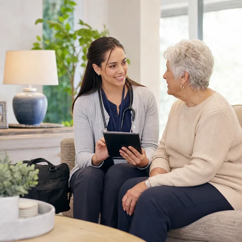 Clinician coordinating mobile primary care support in a residential care setting.